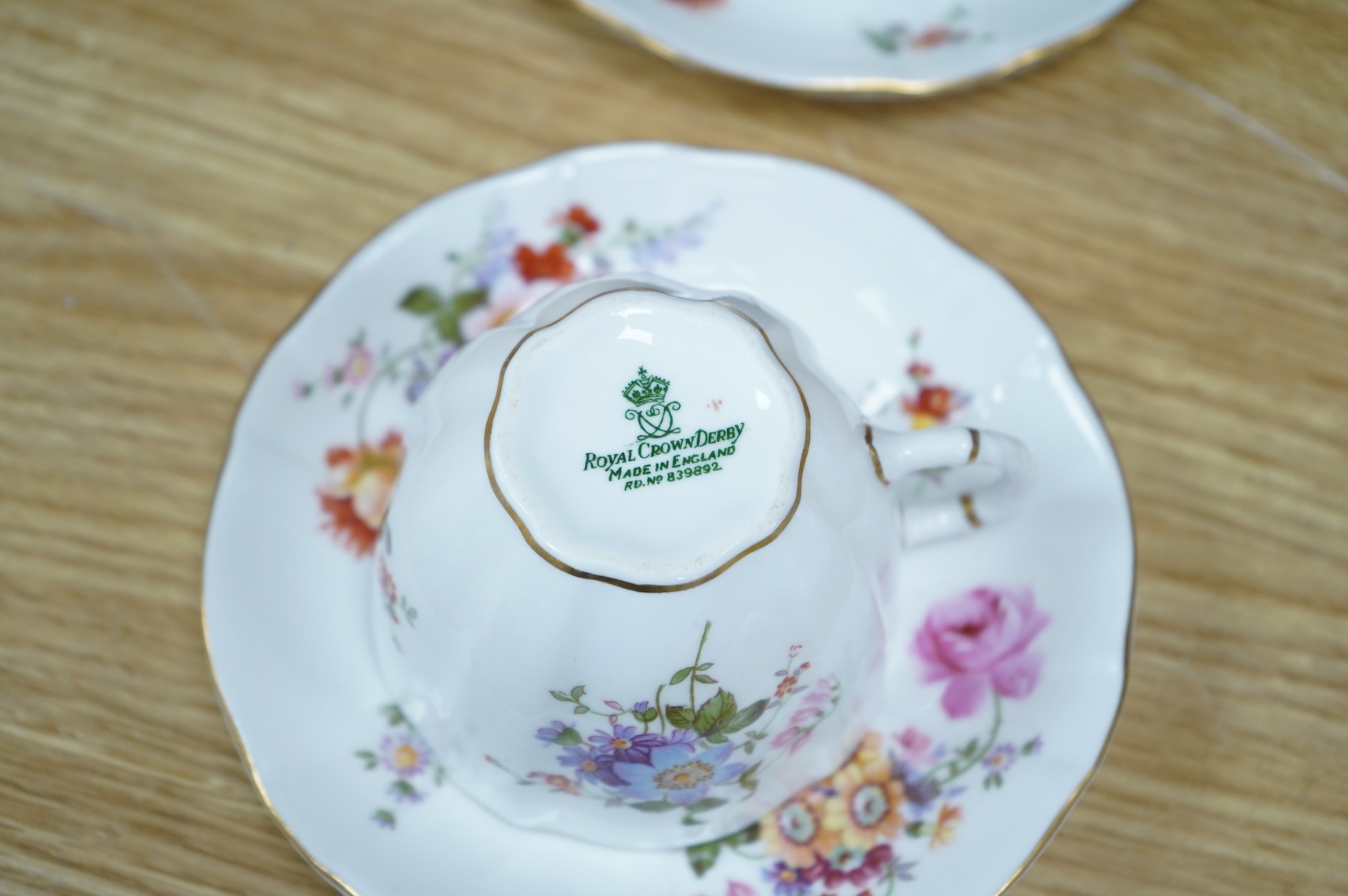 A Royal Crown Derby tea for two set, and a Royal Worcester Lavinia pattern part tea set to include trios, largest 20cm wide